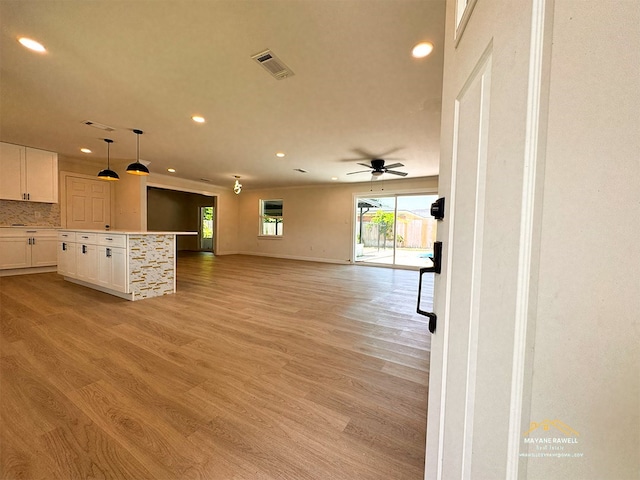 2630 34th St, Port Arthur, TX 77640 - unfurnished living room featuring light wood-style floors, recessed lighting, and a ceiling fan