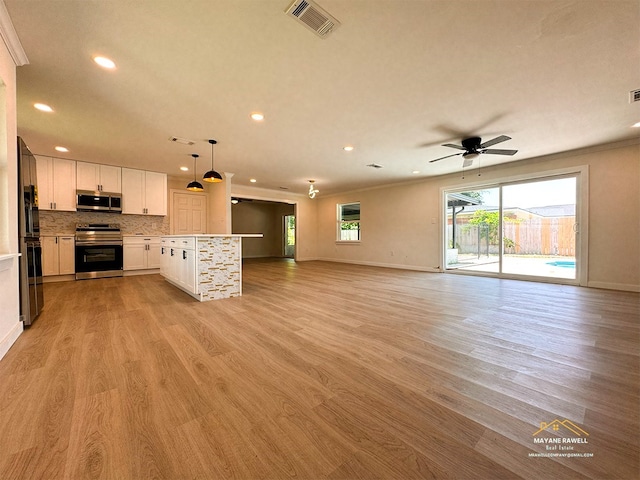 2630 34th St, Port Arthur, TX 77640 - unfurnished living room featuring recessed lighting, light wood-type flooring, a ceiling fan, and crown molding