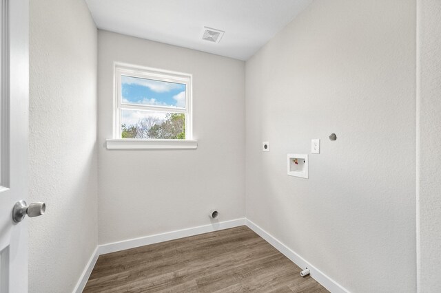 6313 Sandra St, Houston, TX 77028 - washroom with electric dryer hookup, hookup for a washing machine, and wood finished floors