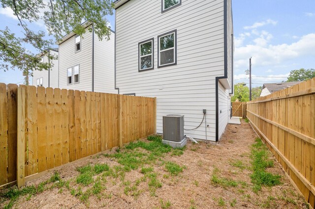 6313 Sandra St, Houston, TX 77028 - rear view of house with a fenced backyard