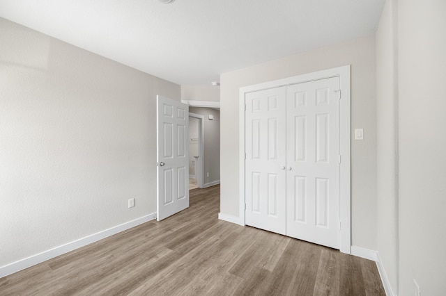 6313 Sandra St, Houston, TX 77028 - unfurnished bedroom featuring wood finished floors and a closet