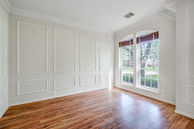 7422 Quiet Glen Dr, Sugar Land, TX 77479 - empty room featuring healthy amount of natural light, wood-type flooring, and crown molding