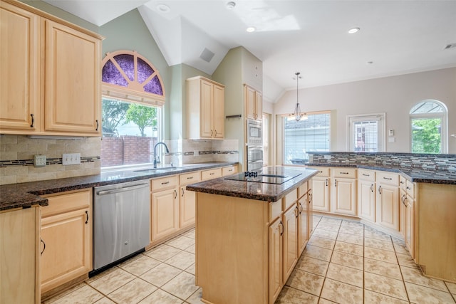 7422 Quiet Glen Dr, Sugar Land, TX 77479 - kitchen featuring appliances with stainless steel finishes, light brown cabinets, a center island, lofted ceiling, and backsplash