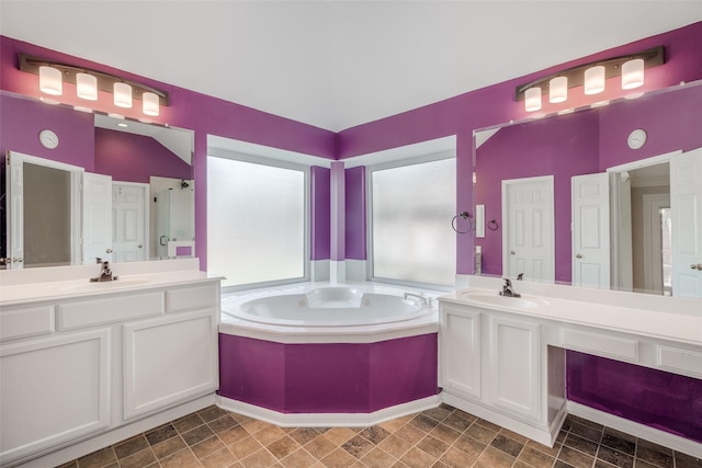 7422 Quiet Glen Dr, Sugar Land, TX 77479 - bathroom featuring a garden tub and two vanities