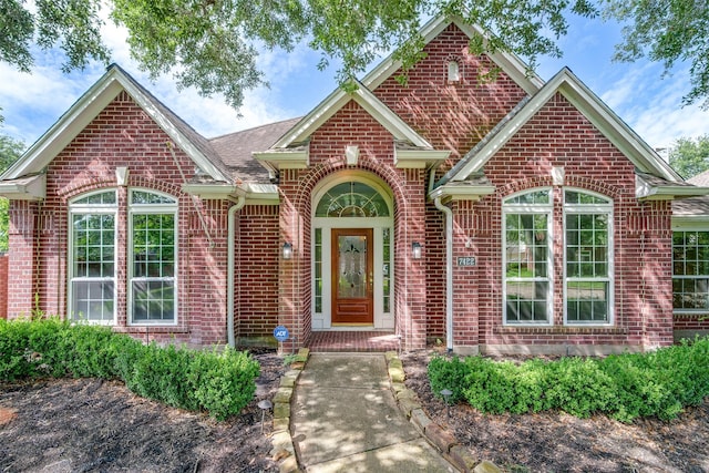 7422 Quiet Glen Dr, Sugar Land, TX 77479 - traditional home with brick siding and roof with shingles