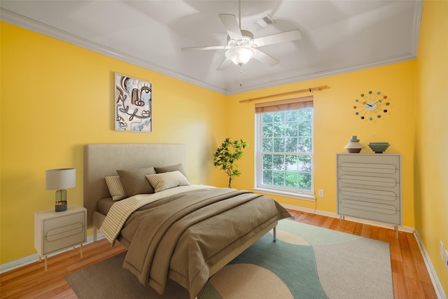 7422 Quiet Glen Dr, Sugar Land, TX 77479 - bedroom featuring ornamental molding, wood finished floors, and a ceiling fan