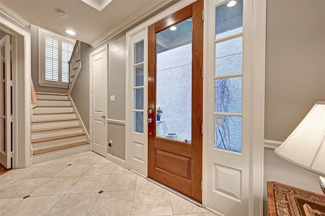 109 Dennis St, Houston, TX 77006 - entrance foyer with light tile patterned flooring, stairs, recessed lighting, and plenty of natural light