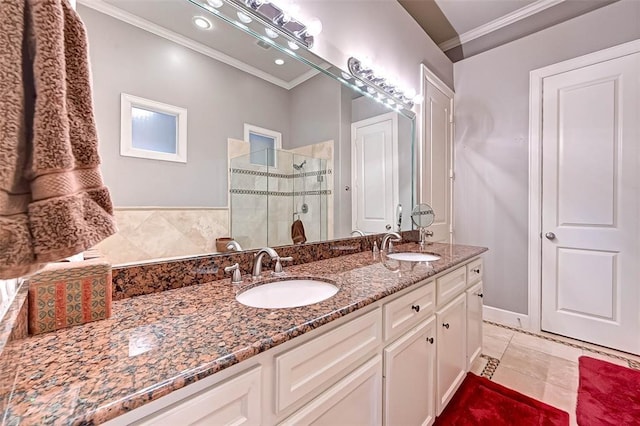 109 Dennis St, Houston, TX 77006 - full bathroom featuring ornamental molding, double vanity, a stall shower, and tile patterned floors