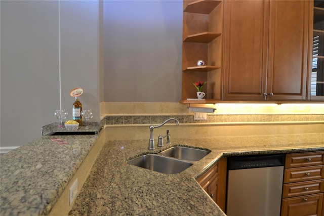 109 Dennis St, Houston, TX 77006 - kitchen with dishwasher, open shelves, light stone counters, and brown cabinetry