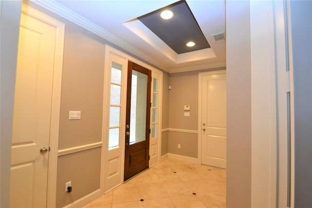 109 Dennis St, Houston, TX 77006 - entryway with a tray ceiling, light tile patterned floors, ornamental molding, and recessed lighting