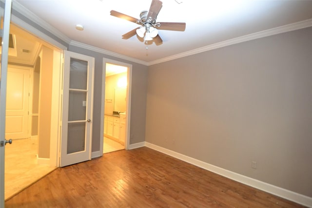 109 Dennis St, Houston, TX 77006 - unfurnished bedroom with wood finished floors, ornamental molding, connected bathroom, and a ceiling fan