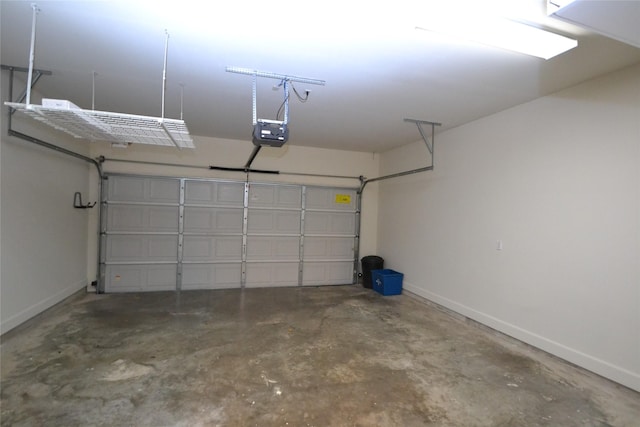 109 Dennis St, Houston, TX 77006 - garage with baseboards and a garage door opener