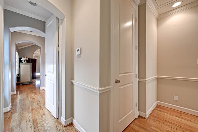 109 Dennis St, Houston, TX 77006 - corridor with arched walkways, ornamental molding, and light wood-type flooring