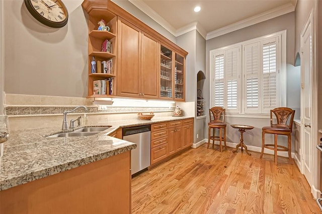 109 Dennis St, Houston, TX 77006 - kitchen with stainless steel dishwasher, open shelves, ornamental molding, glass insert cabinets, and light stone countertops