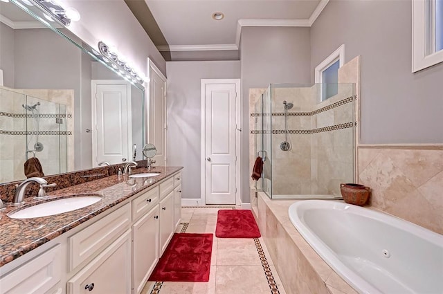 109 Dennis St, Houston, TX 77006 - bathroom with a jetted tub, a shower stall, double vanity, crown molding, and tile patterned flooring