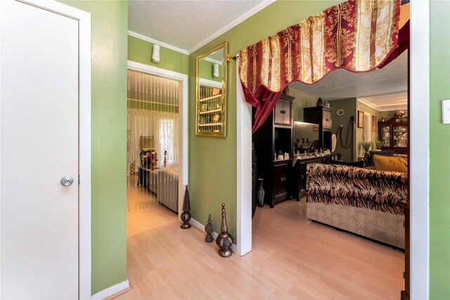408 Rolling Wood Rd, Baytown, TX 77520 - bedroom featuring light wood-type flooring and crown molding