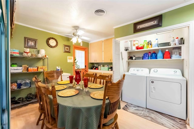 408 Rolling Wood Rd, Baytown, TX 77520 - dining area featuring independent washer and dryer, a ceiling fan, and crown molding