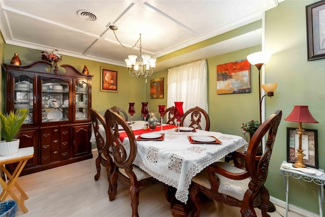 408 Rolling Wood Rd, Baytown, TX 77520 - dining area featuring a chandelier and light wood-style floors
