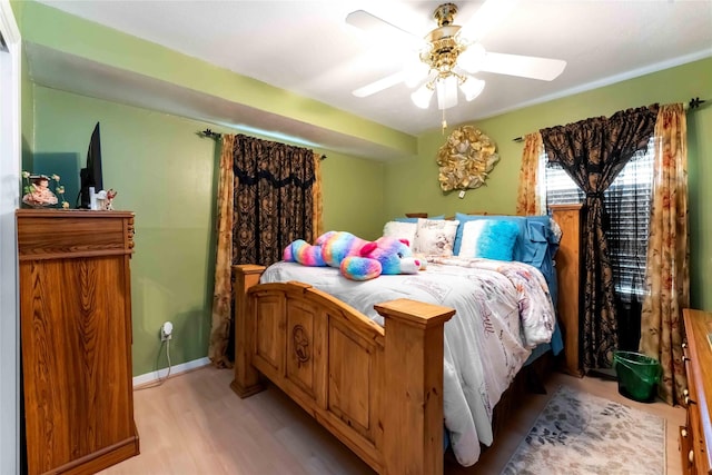408 Rolling Wood Rd, Baytown, TX 77520 - bedroom featuring light wood-style floors and a ceiling fan