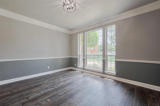 9526 Fern Wood Frst, Houston, TX 77040 - empty room featuring healthy amount of natural light, dark wood finished floors, ornamental molding, a textured wall, and a textured ceiling
