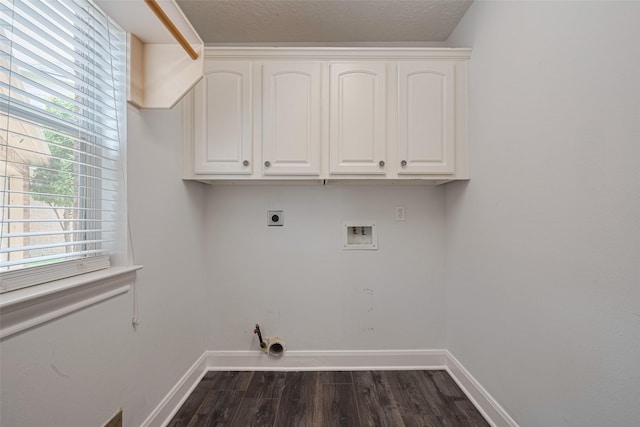 9526 Fern Wood Frst, Houston, TX 77040 - laundry area with dark wood-style floors, cabinet space, hookup for a washing machine, and electric dryer hookup