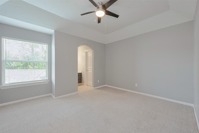 9526 Fern Wood Frst, Houston, TX 77040 - spare room featuring ceiling fan, arched walkways, and light carpet