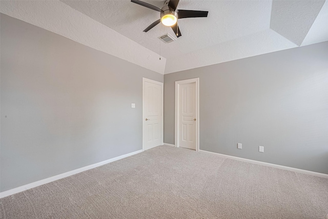 9526 Fern Wood Frst, Houston, TX 77040 - spare room featuring ceiling fan, light carpet, vaulted ceiling, and a textured ceiling