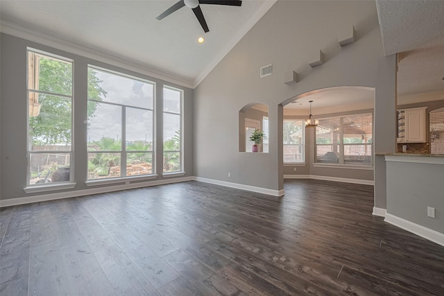 9526 Fern Wood Frst, Houston, TX 77040 - unfurnished living room with ornamental molding, arched walkways, a ceiling fan, dark wood-style flooring, and a chandelier