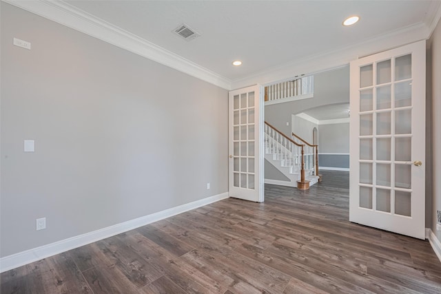 9526 Fern Wood Frst, Houston, TX 77040 - spare room featuring arched walkways, crown molding, french doors, stairs, and dark wood finished floors