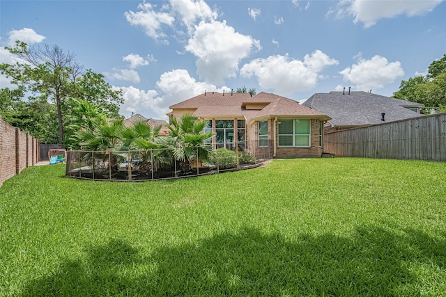 9526 Fern Wood Frst, Houston, TX 77040 - back of property featuring a fenced backyard and brick siding