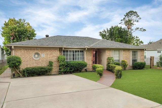 740 Post St, Houston, TX 77022 - ranch-style home with brick siding and a shingled roof