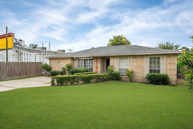 740 Post St, Houston, TX 77022 - ranch-style home with brick siding and a shingled roof
