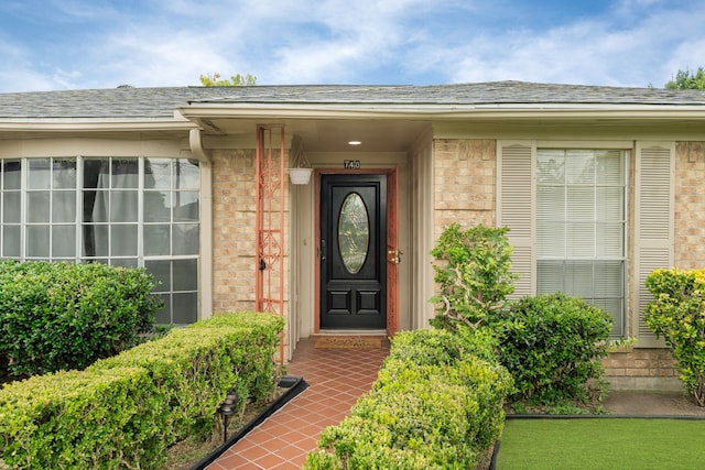 740 Post St, Houston, TX 77022 - entrance to property featuring brick siding and a shingled roof