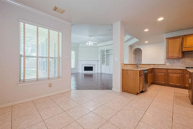 7927 Chateau Point Ln, Houston, TX 77041 - kitchen with dishwasher, light tile patterned flooring, a ceiling fan, decorative backsplash, and light countertops