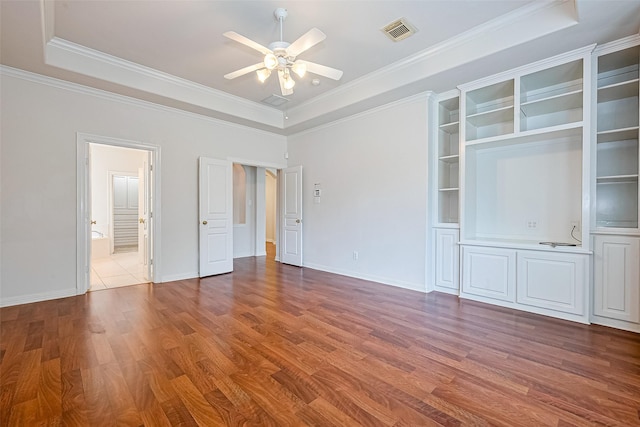 7927 Chateau Point Ln, Houston, TX 77041 - unfurnished room featuring a tray ceiling, a ceiling fan, wood finished floors, and ornamental molding