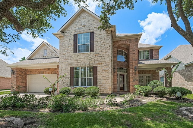 7927 Chateau Point Ln, Houston, TX 77041 - traditional-style home featuring stone siding, an attached garage, and a shingled roof