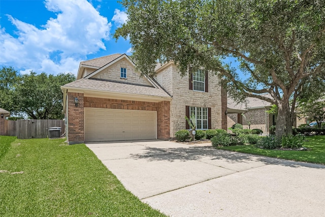 7927 Chateau Point Ln, Houston, TX 77041 - traditional-style home with concrete driveway, an attached garage, a shingled roof, and stone siding