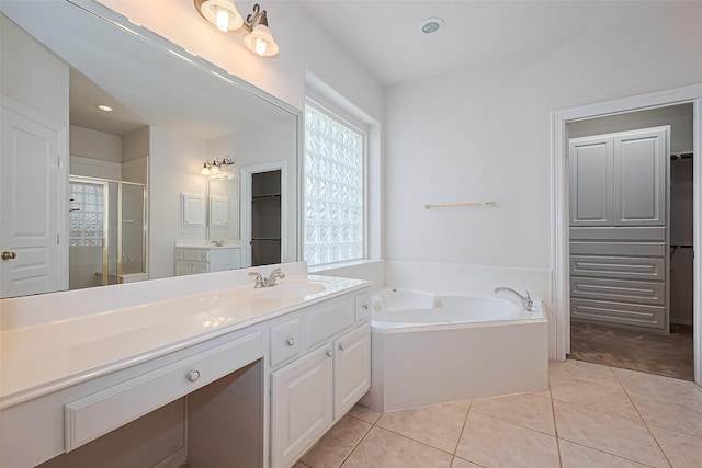 7927 Chateau Point Ln, Houston, TX 77041 - full bath featuring vanity, a stall shower, a bath, tile patterned floors, and a walk in closet