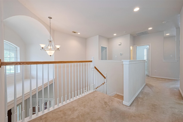 7927 Chateau Point Ln, Houston, TX 77041 - hallway featuring an upstairs landing, light colored carpet, a chandelier, and recessed lighting