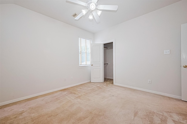7927 Chateau Point Ln, Houston, TX 77041 - unfurnished bedroom with light colored carpet, a walk in closet, and ceiling fan