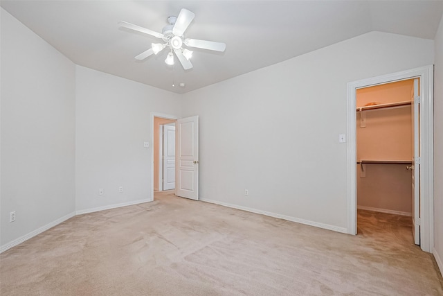 7927 Chateau Point Ln, Houston, TX 77041 - unfurnished bedroom with a spacious closet, light carpet, lofted ceiling, a closet, and a ceiling fan