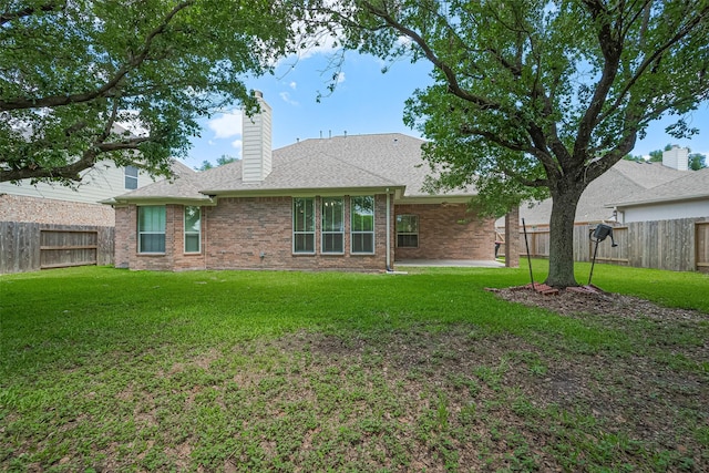 7927 Chateau Point Ln, Houston, TX 77041 - rear view of property featuring a fenced backyard, brick siding, a chimney, a patio area, and a shingled roof