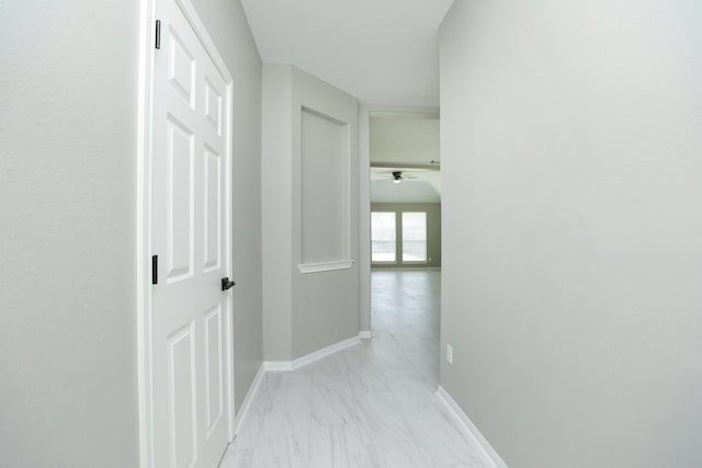 2522 Cardinal Elm St, Fresno, TX 77545 - hallway with light marble finish flooring and baseboards