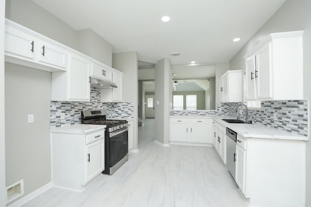 2522 Cardinal Elm St, Fresno, TX 77545 - kitchen with appliances with stainless steel finishes, under cabinet range hood, ceiling fan, backsplash, and recessed lighting