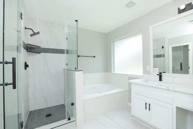 2522 Cardinal Elm St, Fresno, TX 77545 - bathroom featuring a garden tub, a shower stall, vanity, and marble finish flooring
