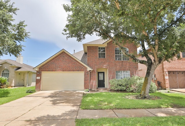 2522 Cardinal Elm St, Fresno, TX 77545 - traditional-style house featuring brick siding, a garage, driveway, a front lawn, and a shingled roof