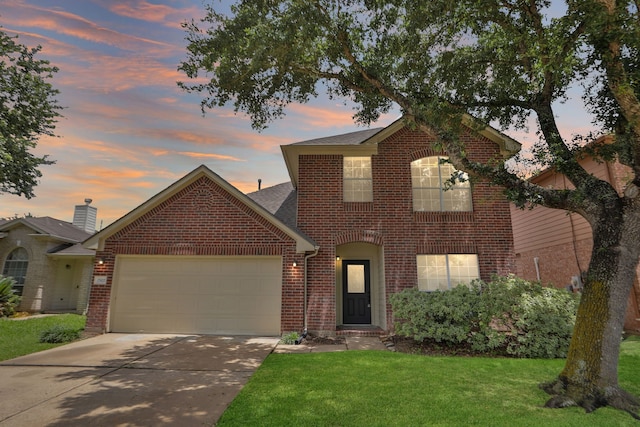 2522 Cardinal Elm St, Fresno, TX 77545 - traditional-style house featuring brick siding, an attached garage, driveway, a yard, and a shingled roof