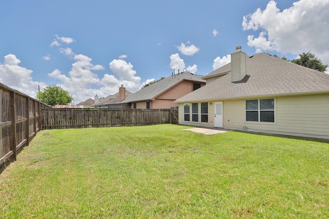 2522 Cardinal Elm St, Fresno, TX 77545 - back of property featuring a fenced backyard, a patio, a chimney, and roof with shingles