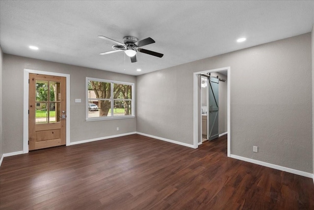 2909 15th Ave N, Texas City, TX 77590 - spare room with wood finished floors, a ceiling fan, plenty of natural light, a barn door, and recessed lighting