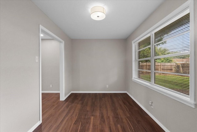 2909 15th Ave N, Texas City, TX 77590 - empty room with dark wood-style floors and baseboards